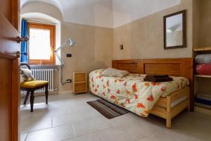Posteľ alebo postele v izbe v ubytovaní Arvé Castelbianco - B&B e Appartamento