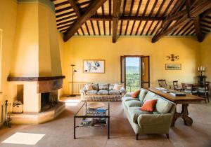 a living room with a couch and a fireplace at Fonte Sala in Montefalco