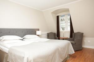 Postel nebo postele na pokoji v ubytování Elite Hotel Savoy