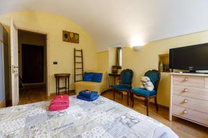 Posteľ alebo postele v izbe v ubytovaní Arvé Castelbianco - B&B e Appartamento