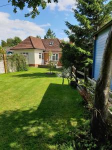 a yard with a house and a fence at Old Telephone Exchange in North Thoresby