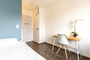 Postel nebo postele na pokoji v ubytování Hostel by Hyve Basel