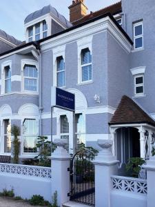 a house with a sign in front of it at 15 Grosvenor in Hastings