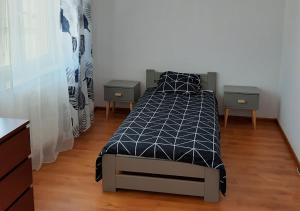 Кровать или кровати в номере Apartament dwupoziomowy
