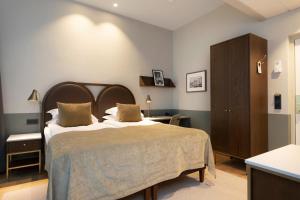 Postel nebo postele na pokoji v ubytování Elite Hotel Savoy