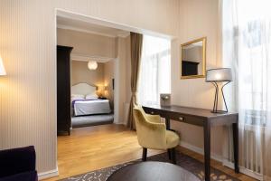 Postel nebo postele na pokoji v ubytování Elite Hotel Savoy