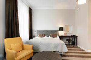 Postel nebo postele na pokoji v ubytování Elite Hotel Savoy