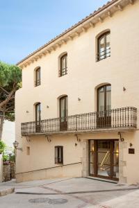 an exterior view of a building with a balcony at La Bionda Hotel - Adults Only in Begur