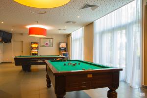 a billiard room with two pool tables in it at Floreal Blankenberge in Blankenberge