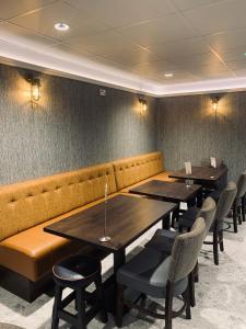 a row of tables and chairs in a restaurant at Kilmorey Arms Hotel in Kilkeel