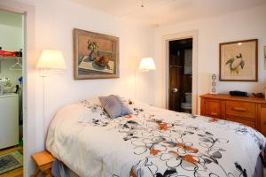 a bedroom with a bed and two lamps at Fairhaven in Pulteney