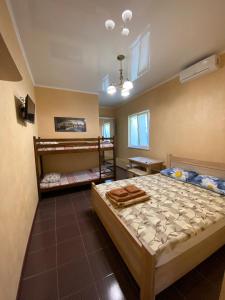a bedroom with two bunk beds in it at Людмила in Chornomorsk
