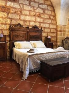 Postel nebo postele na pokoji v ubytování Masseria Scianne