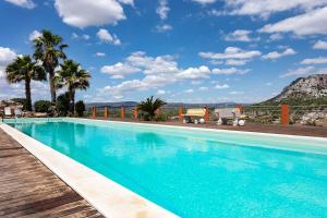 a swimming pool with a view of a mountain at B&B Madre Vita in Belvedere