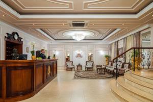 a living room filled with furniture and a stair case at Mozart Hotel in Odesa