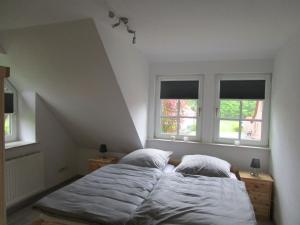 En eller flere senge i et værelse på Landhaus von Frieling