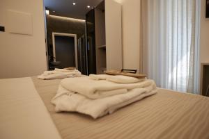 Łóżko lub łóżka w pokoju w obiekcie Orizzonte MHotel