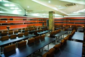 a dining room with tables and chairs in it at Park Hotel in Ulaanbaatar
