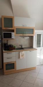 A cozinha ou cozinha compacta de Appartamento Antica Ruvo