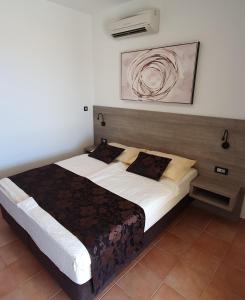 a bedroom with a large bed in a room at Villa Anka in Rab