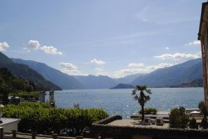 a view of a large body of water with mountains at Suite Villa Lillia in Bellagio