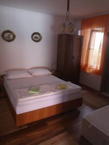 Postel nebo postele na pokoji v ubytování Apartment Dada