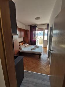 Posteľ alebo postele v izbe v ubytovaní Apartmani Škarić