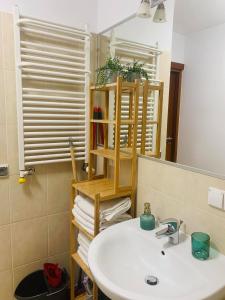 a bathroom with a sink and a mirror at Apartament przy plaży in Władysławowo +7 photos