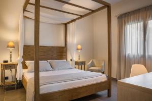 Postel nebo postele na pokoji v ubytování ASTRA Village Resort + 37 fotografií