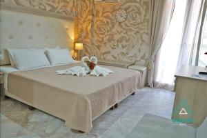 Postel nebo postele na pokoji v ubytování Hotel Atlantis