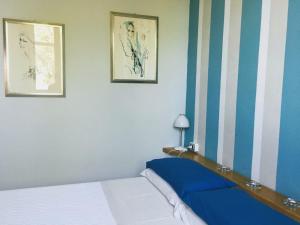 A bed or beds in a room at Holiday Home Cannubi in Barolo