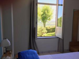 A bed or beds in a room at Holiday Home Cannubi in Barolo