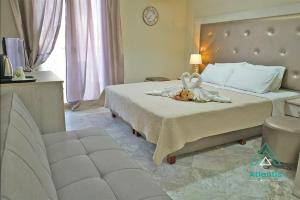 Postel nebo postele na pokoji v ubytování Hotel Atlantis