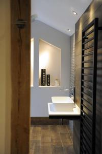 a bathroom with a white sink and a mirror at 1692 Wasdale in Gosforth