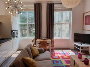 a living room with a couch and a table at St Martins View in York