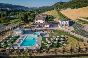 an aerial view of a resort with a swimming pool at Borgopetra in Sogliano al Rubicone