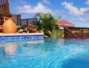 a swimming pool with a vase on the side of it at Ocean Crest in Castries