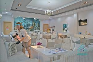 TV a/nebo společenská místnost v ubytování Hotel Atlantis