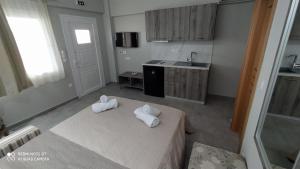 Posteľ alebo postele v izbe v ubytovaní ONAR by the sea Luxurious Apartments