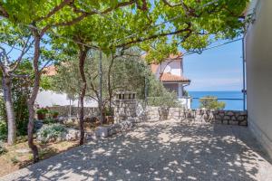 a villa with a view of the ocean at Apartments Anci in Mali Lošinj