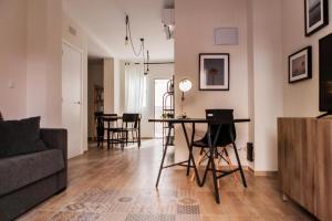 a living room with a table and chairs at Marxalenes Apartments in Valencia