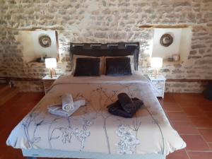 Postel nebo postele na pokoji v ubytování gîte le tilleul de la Fontaine