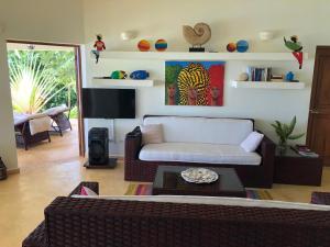 a living room with a couch and a table at Bella Vista in Las Terrenas