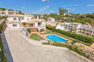 an aerial view of a house with a swimming pool at Vivenda Vista Mar in Carvoeiro