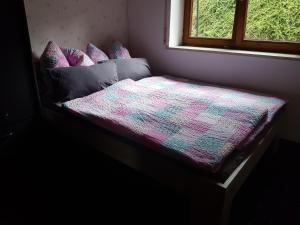 Postel nebo postele na pokoji v ubytování Ferienwohnung Sonthofenersee