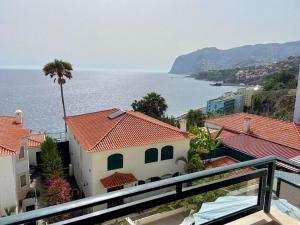 a view of the ocean from a balcony at Ocean Cliffs Apartments in Funchal