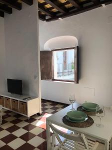 Televízia a/alebo spoločenská miestnosť v ubytovaní Conil Homes III Apartments