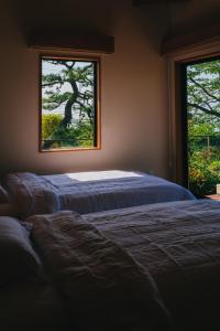 A bed or beds in a room at Ajina House - Vacation STAY 84934