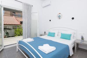 Posteľ alebo postele v izbe v ubytovaní Marion Apartments