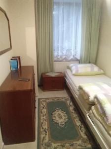 Postel nebo postele na pokoji v ubytování Penzion Marjánka